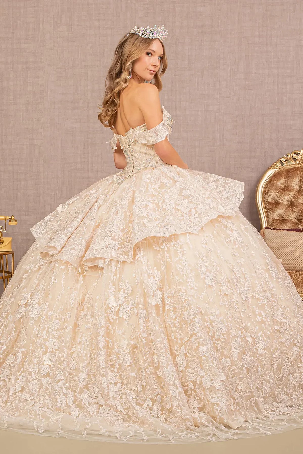 Bodice close-up highlights the Champagne quinceañera ball gown with jeweled mesh skirt.