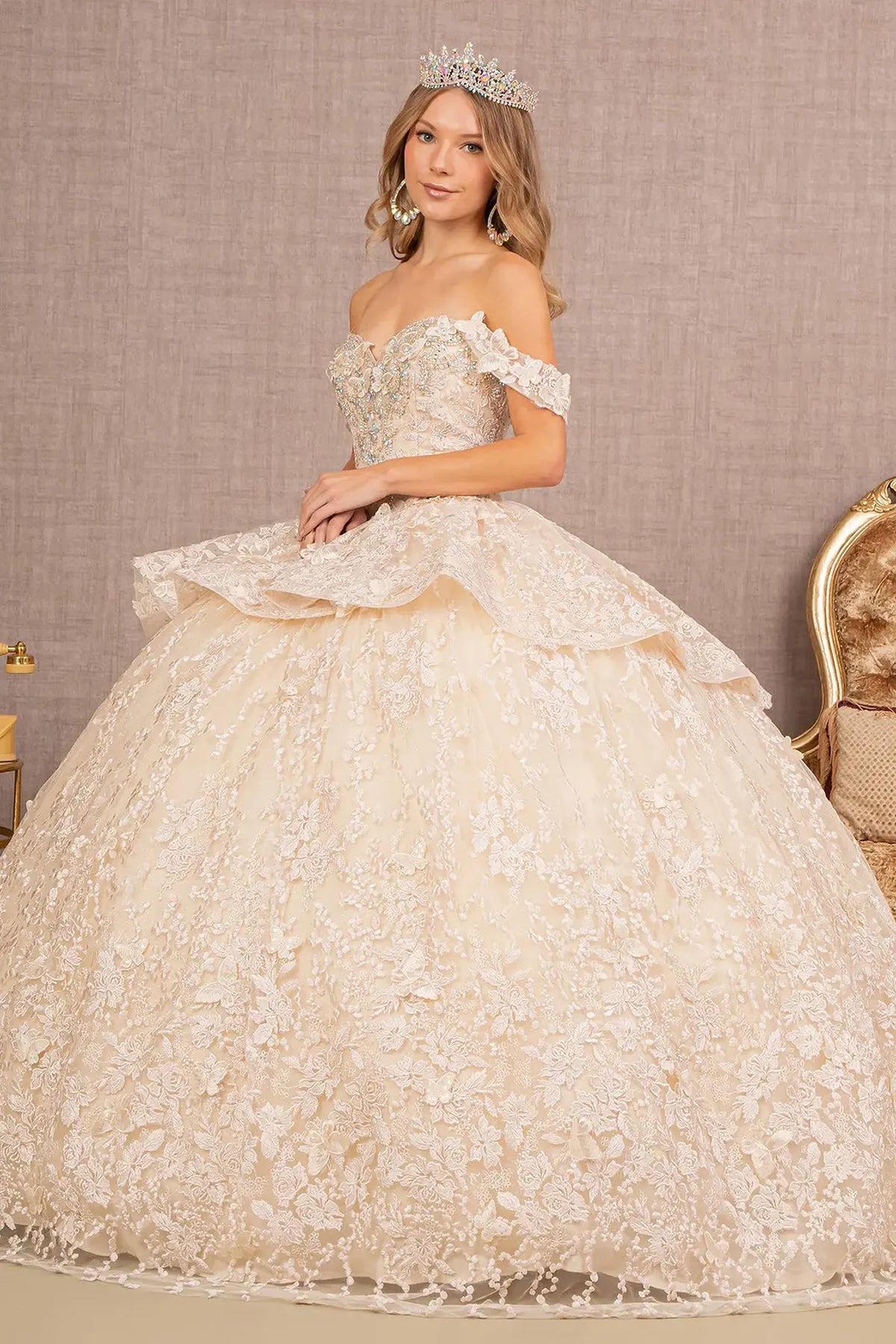 Embroidered details frame the Champagne quinceañera ball gown with 3d butterfly appliqués.