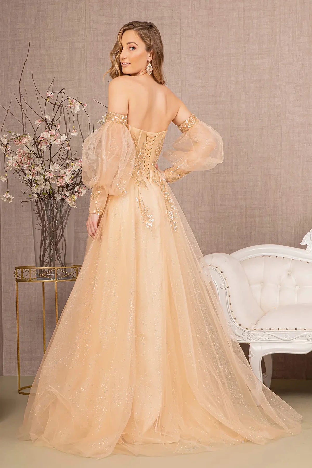 Light Gold mother of the bride dress with a low open back and flowing train
