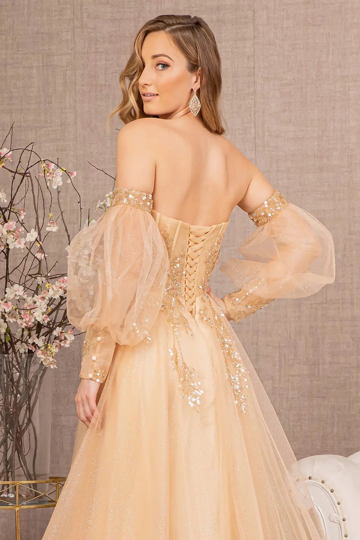 Light Gold mother of the bride dress with voluminous sheer sleeves at the back