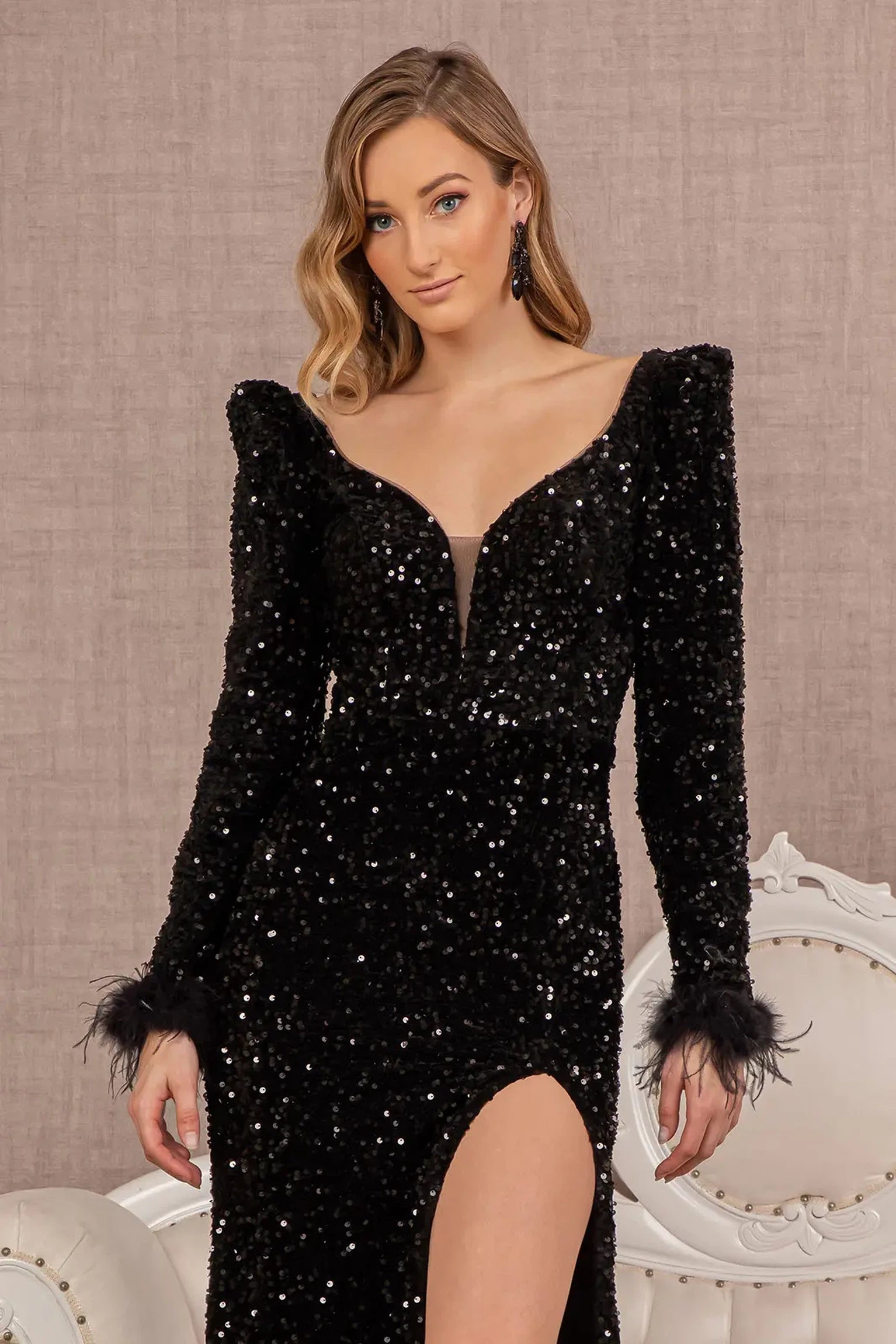 Black mother of the bride dress featuring illusion sweetheart bodice with 3/4 sleeve and feather, sequin