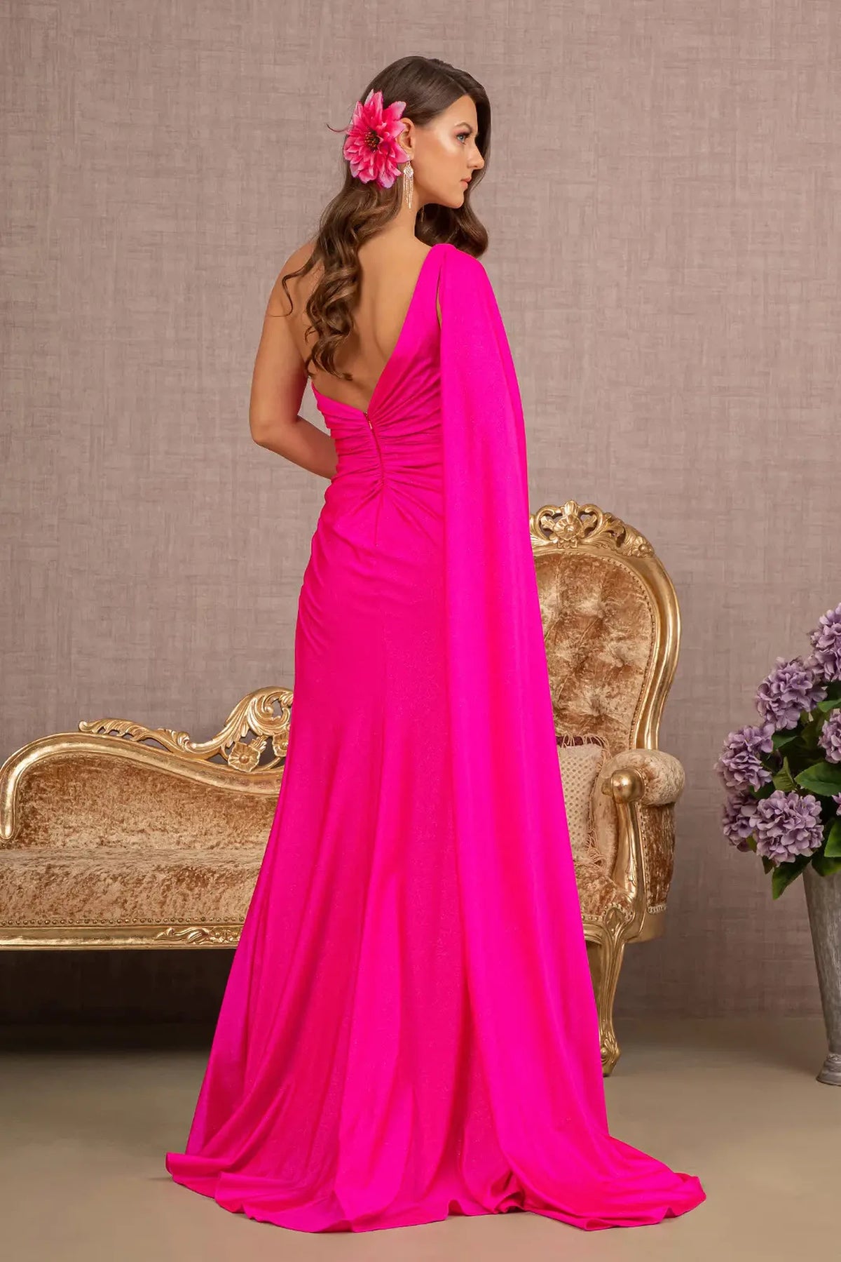 Fuchsia mother of the bride dress with a trailing one-shoulder drape