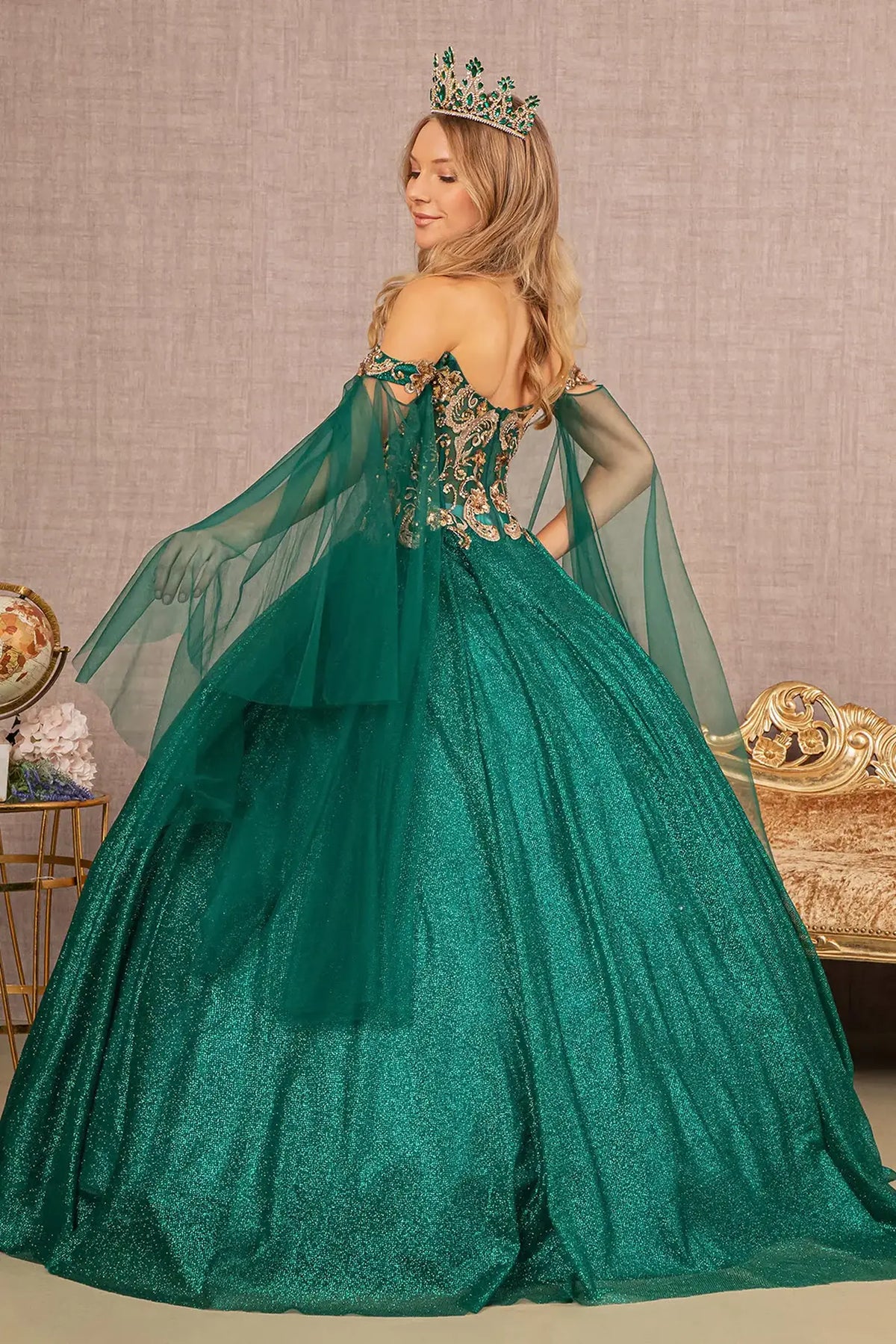 Bodice close-up highlights the Emerald Green quinceañera ball gown with sheer glitter bodice.
