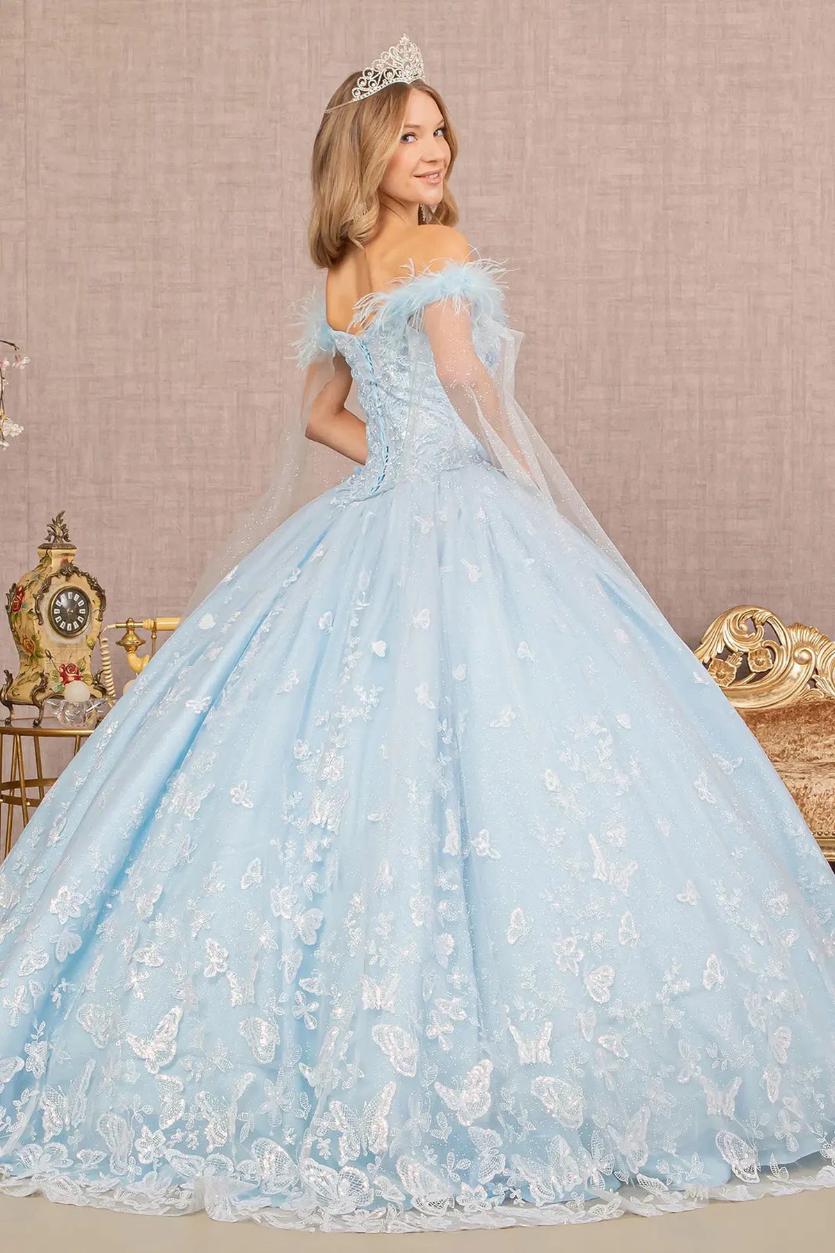 Bodice close-up highlights the Baby Blue quinceañera ball gown with detachable mesh drape.