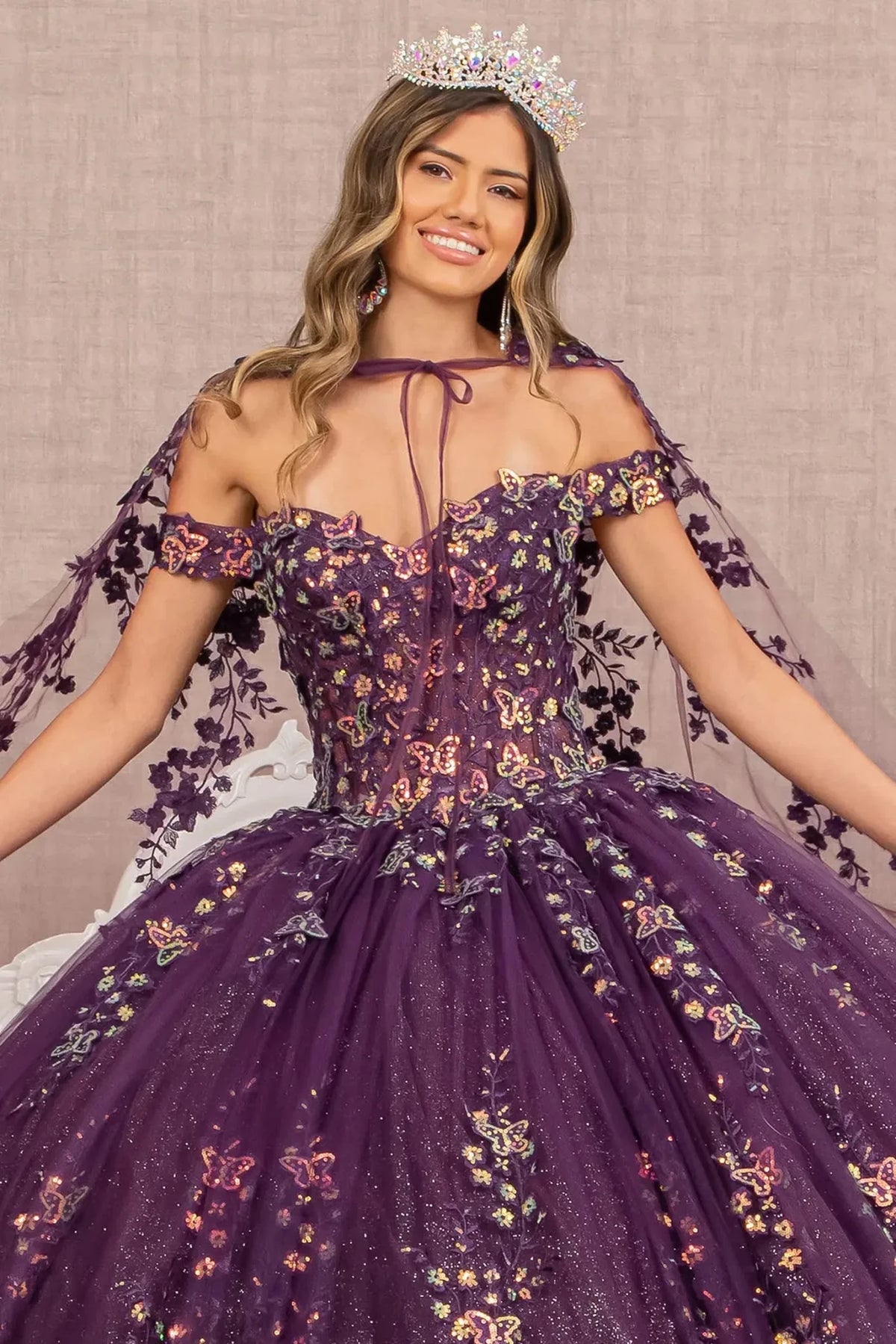 Full-length view presents the Purple quinceañera ball gown with 3d butterfly appliqués.