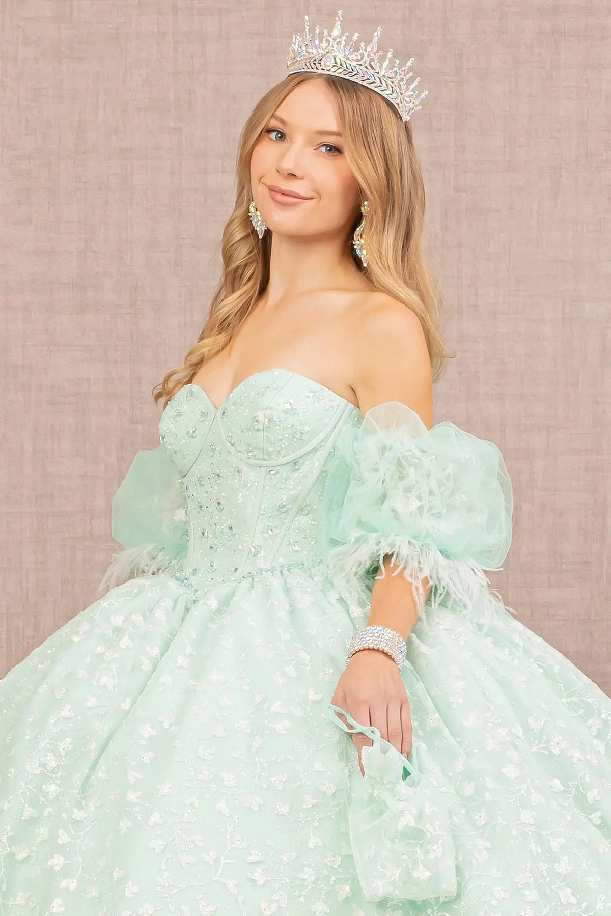 Full-length view presents the Mint quinceañera ball gown with detachable puff sleeves.