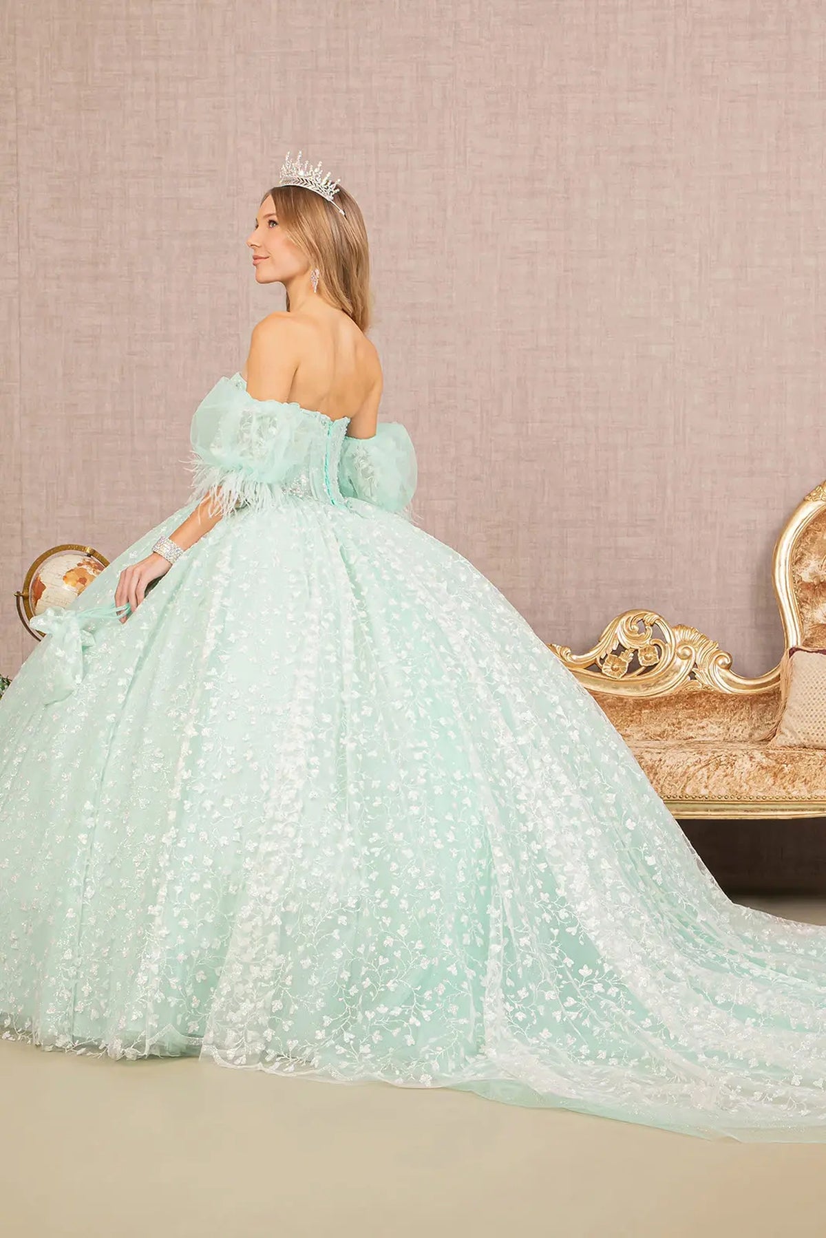 Bodice close-up highlights the Mint quinceañera ball gown with matching mini bag.