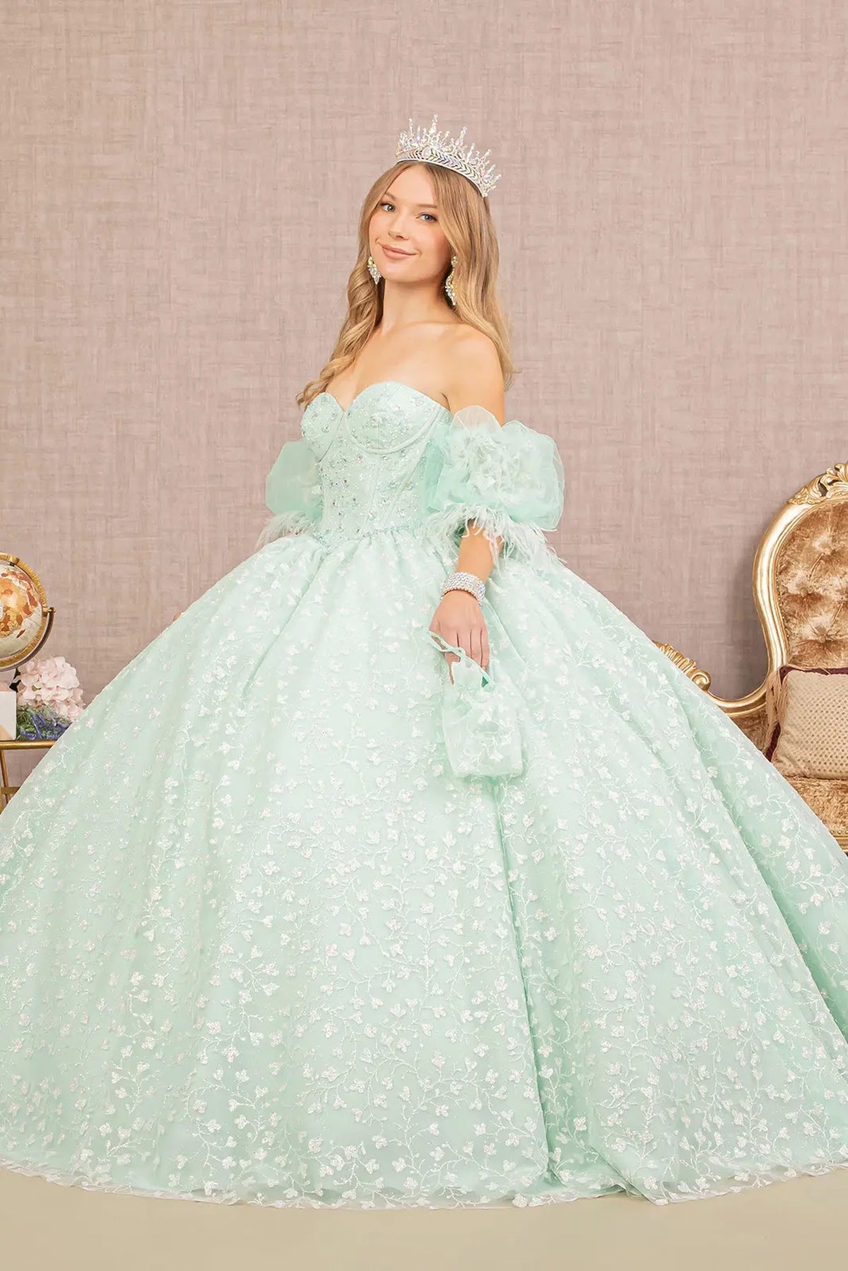 Embroidered details frame the Mint quinceañera ball gown with detachable puff sleeves.