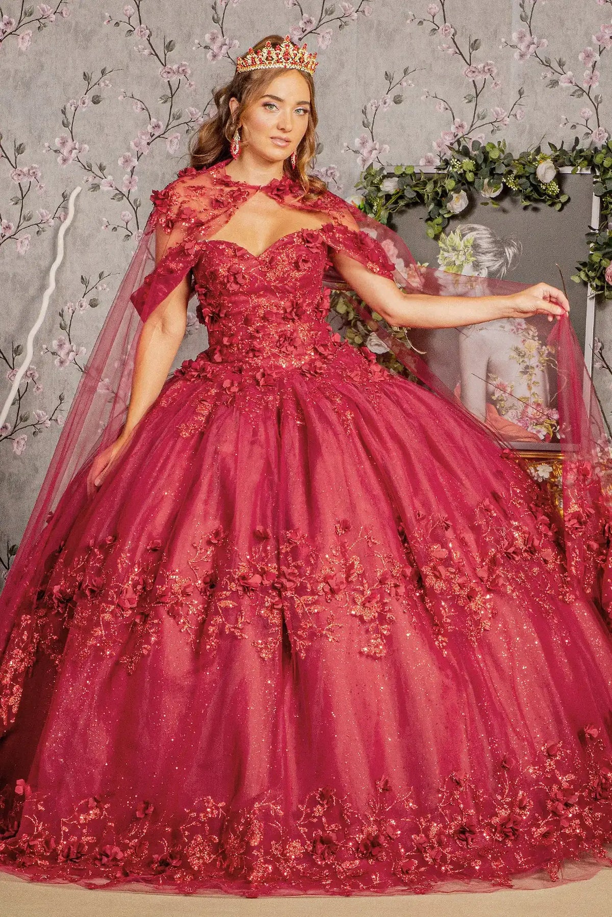 Full-length view presents the Burgundy quinceañera ball gown with long mesh cape.