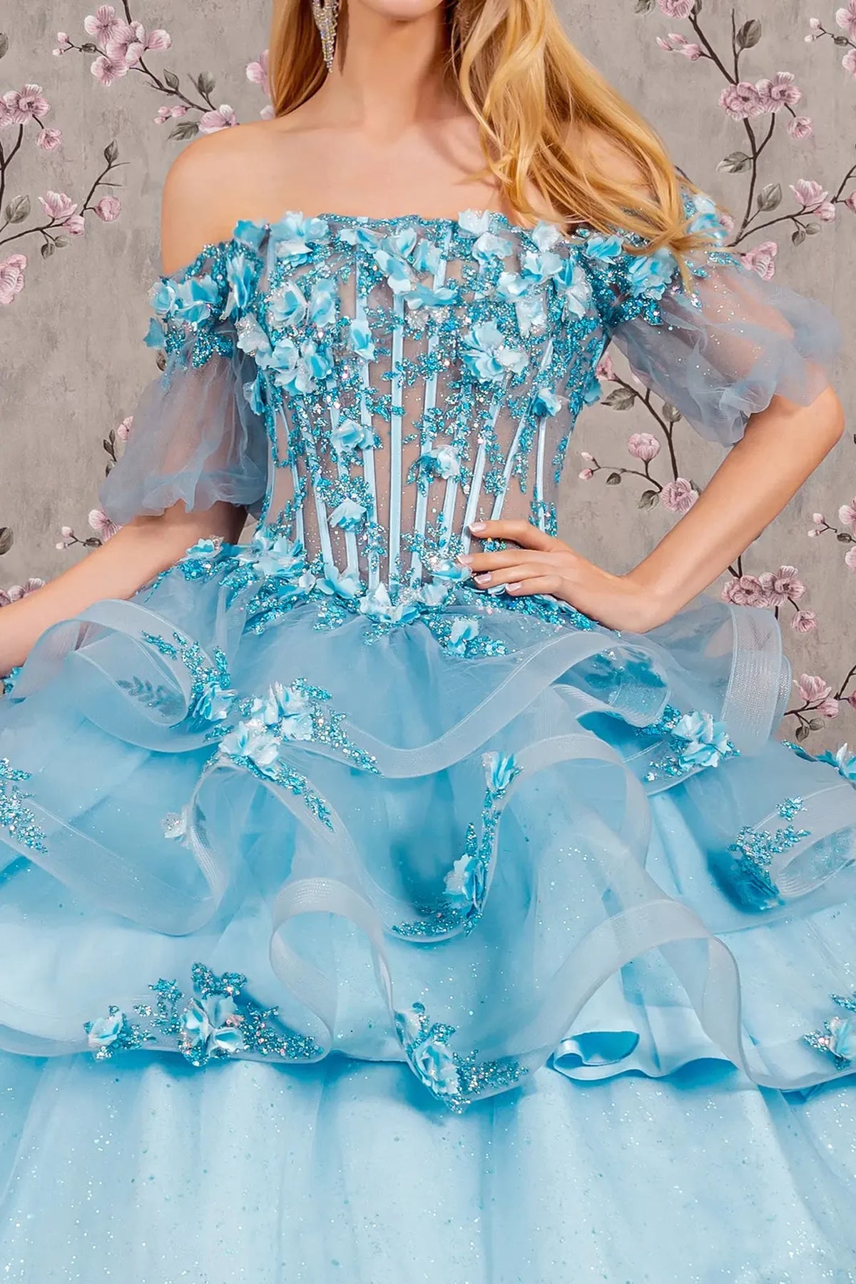 Full-length view presents the Baby Blue quinceañera ball gown with ruffled skirt.