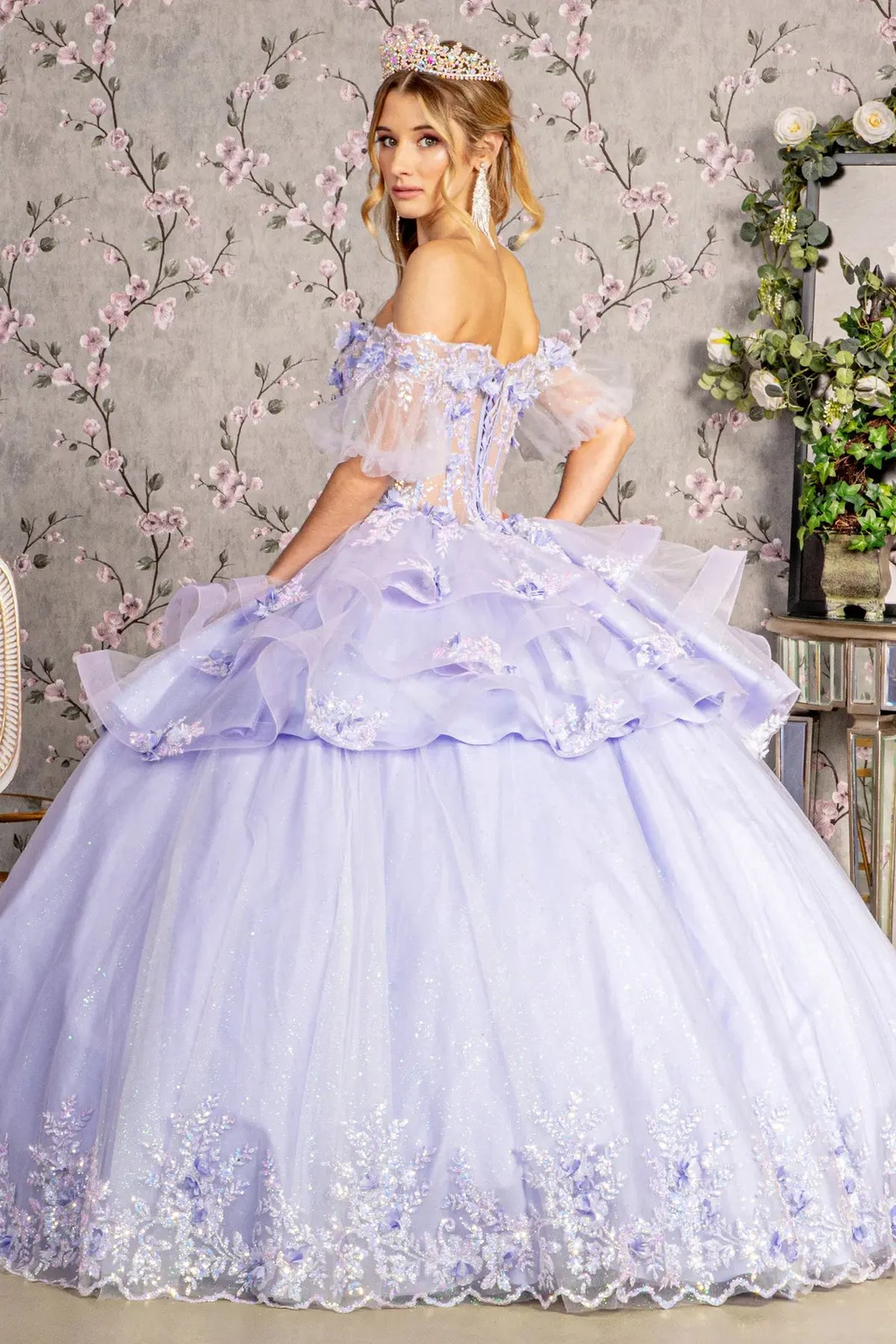 Lace-up back reveals the Lilac quinceañera ball gown with lace-up back and 3d floral appliqués.
