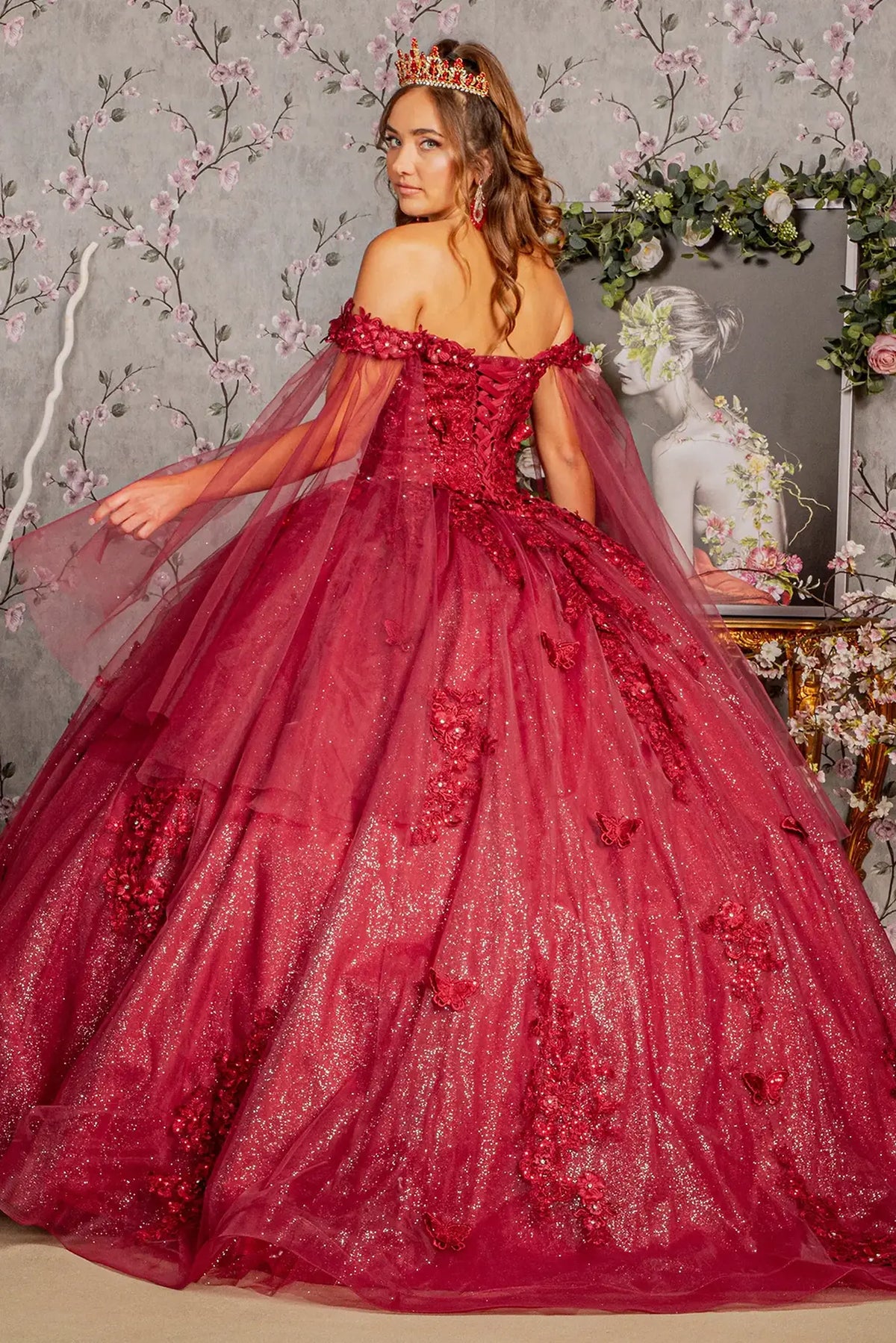 Lace-up back reveals the Burgundy quinceañera ball gown with lace-up back and jeweled glitter mesh.