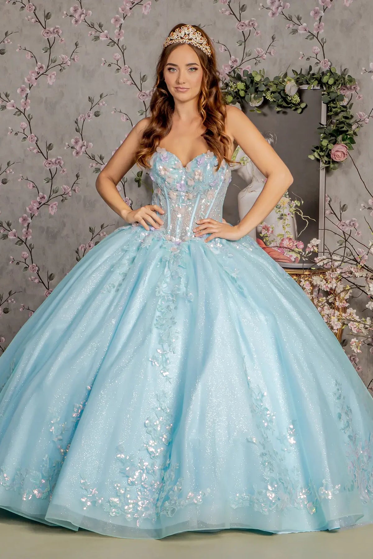 Embroidered details frame the Tiffany Blue quinceañera ball gown with 3d floral embroidery.