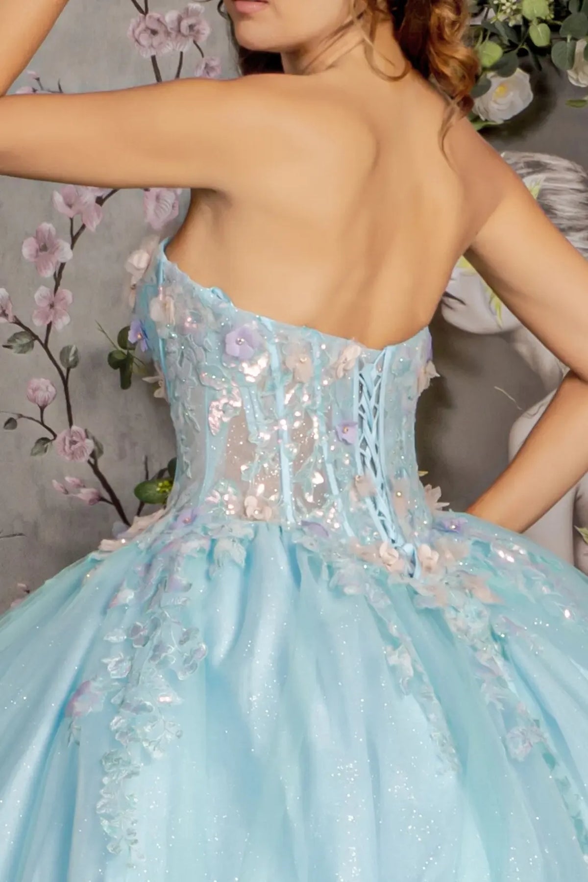 Detachable accents complete the Tiffany Blue quinceañera ball gown with 3d floral embroidery.