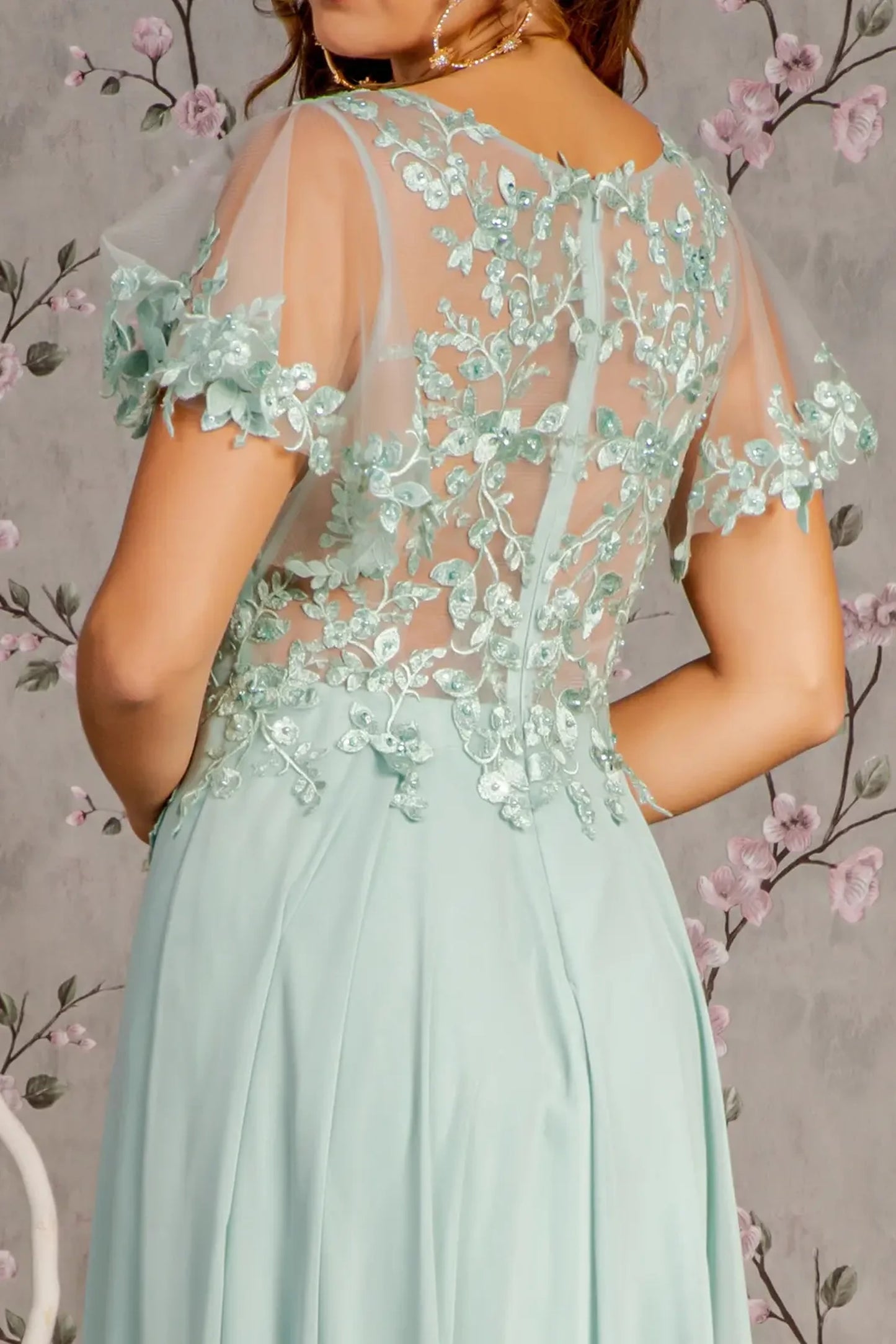 Sage mother of the bride dress featuring open back bodice finished with applique, beads, embroidery, sequin