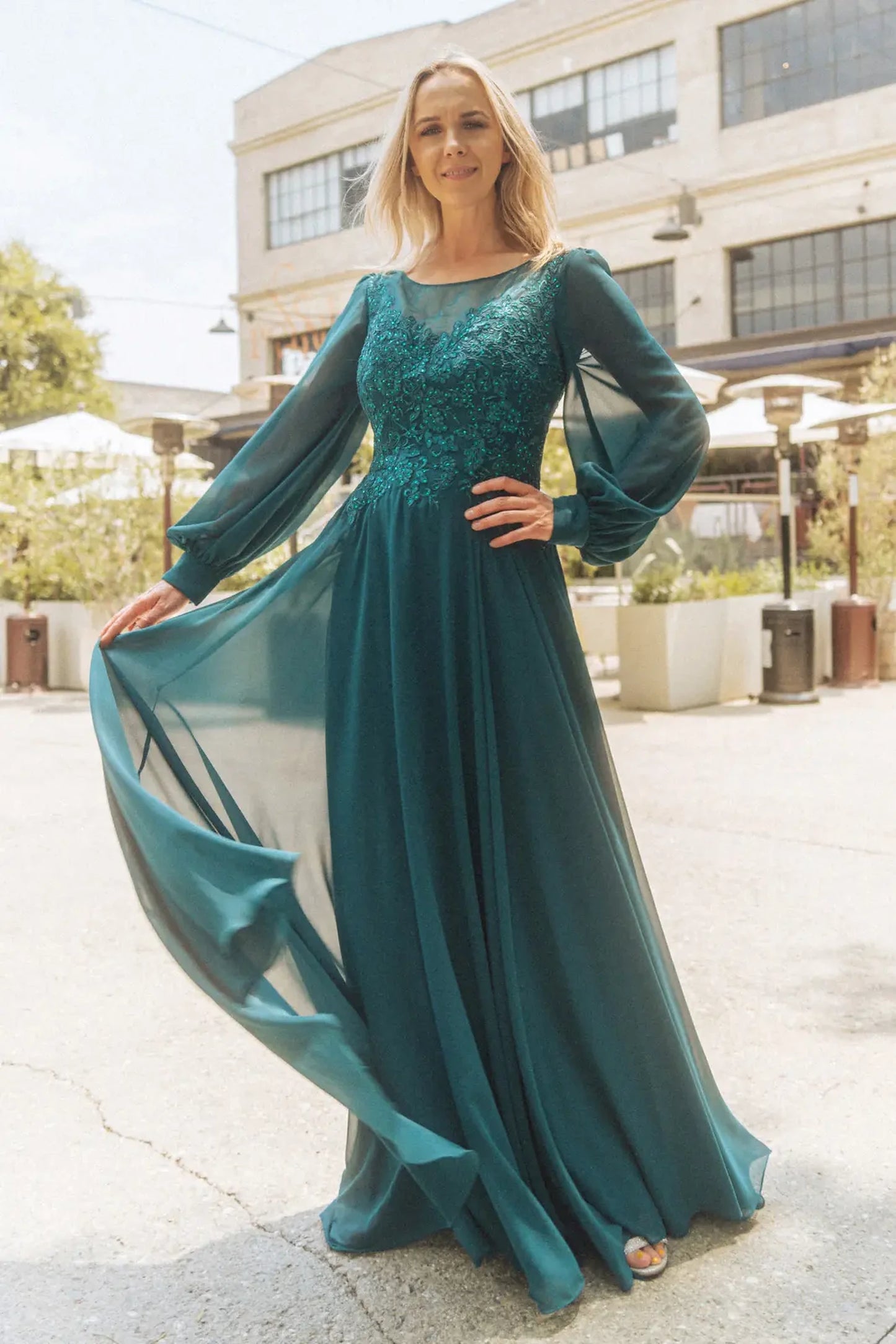 Teal mother of the bride dress featuring concealed zipper back bodice finished with beads, embroidery