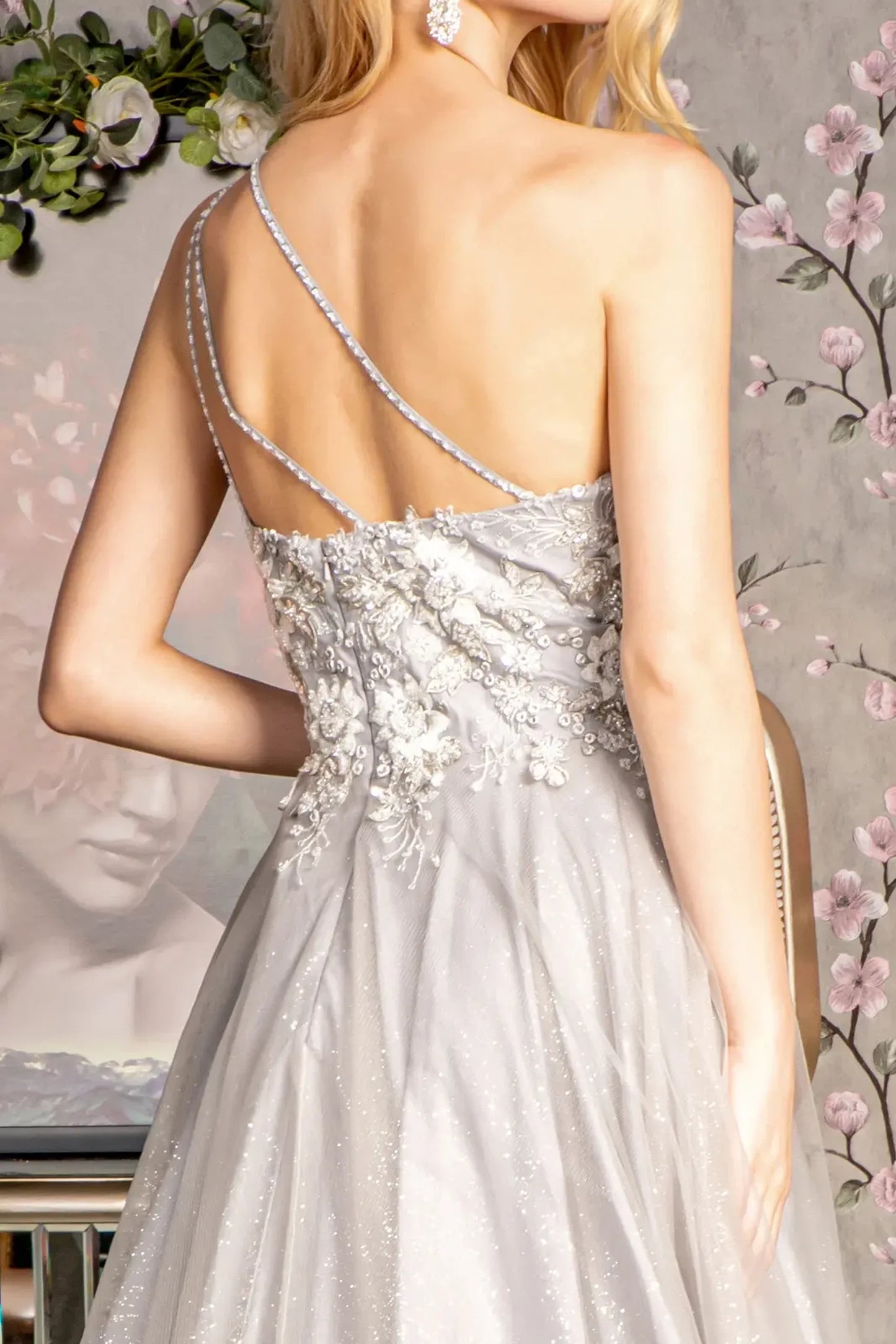 Silver mother of the bride dress featuring open back bodice finished with beads, embroidery, glitter, sequin