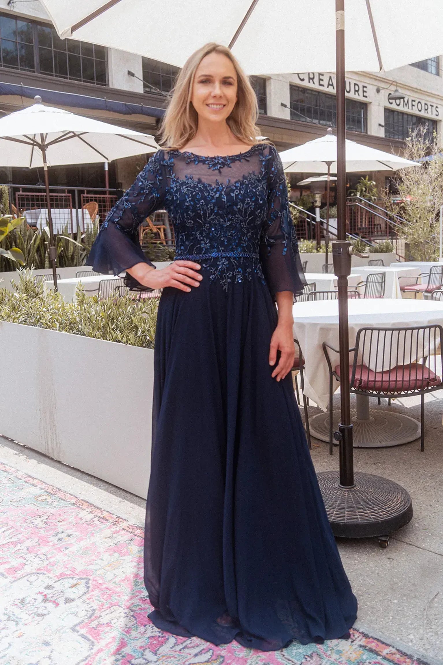 Navy mother of the bride dress featuring concealed zipper back bodice finished with beads, embroidery, sequin