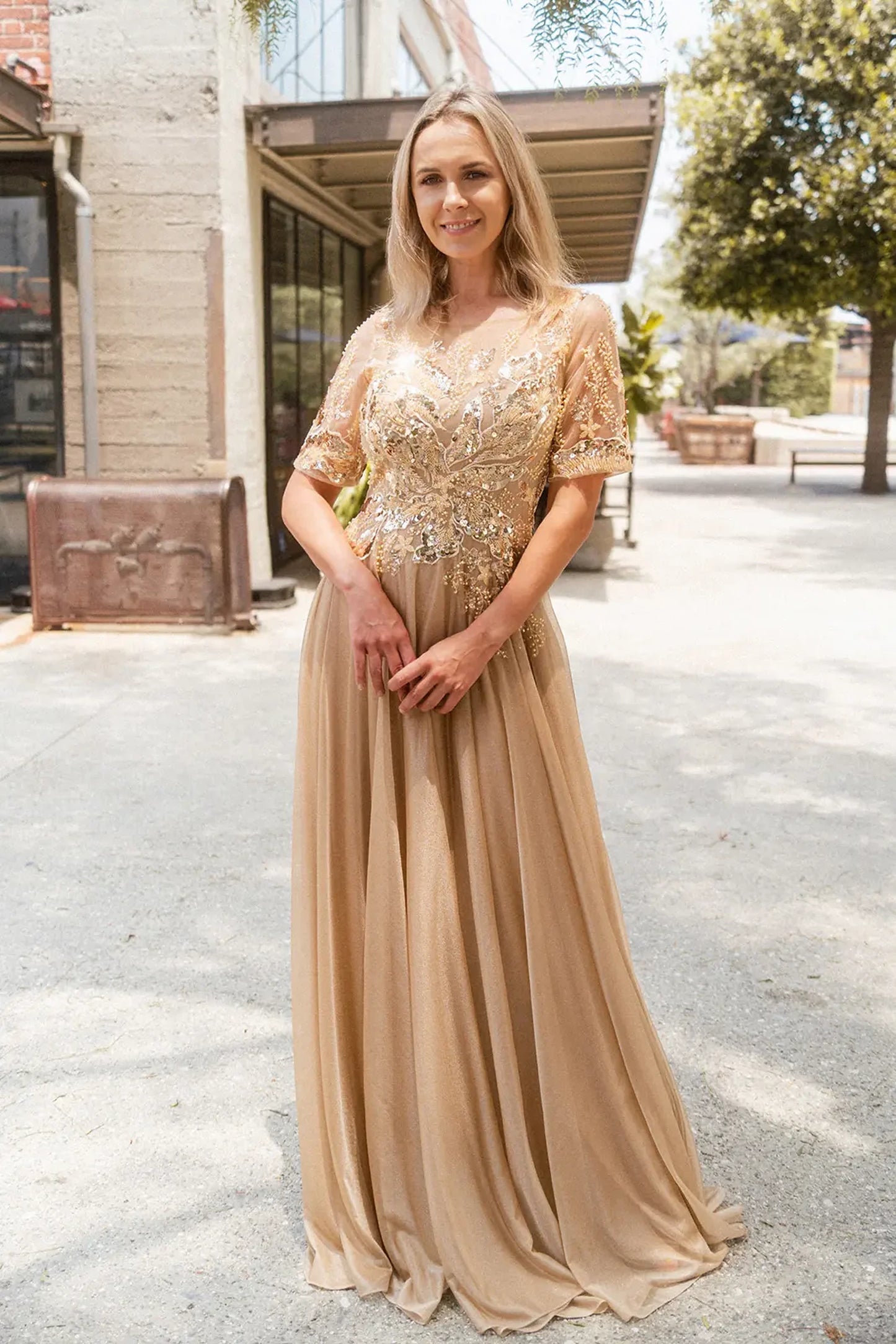 Gold mother of the bride dress featuring concealed zipper back bodice finished with beads, embroidery, metallic, sequin