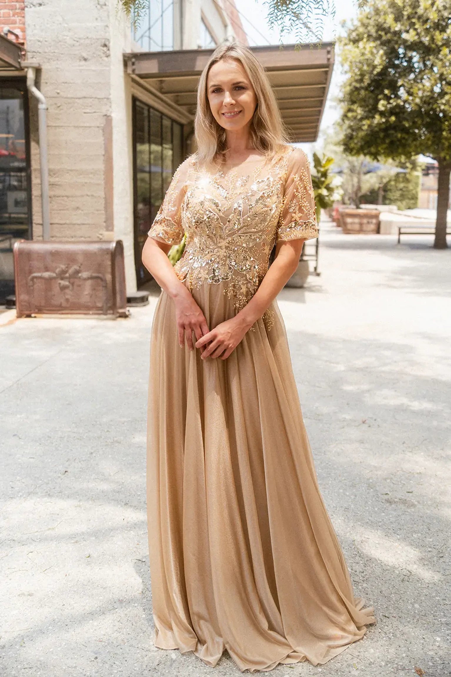 Gold mother of the bride dress featuring concealed zipper back bodice finished with beads, embroidery, metallic, sequin