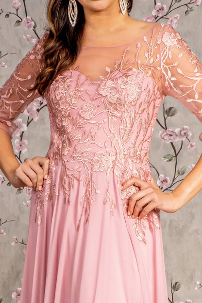 Rear view reveals dusty Rose a-line mother of the bride dress with v-back with concealed zipper and 3/4 sleeve.
