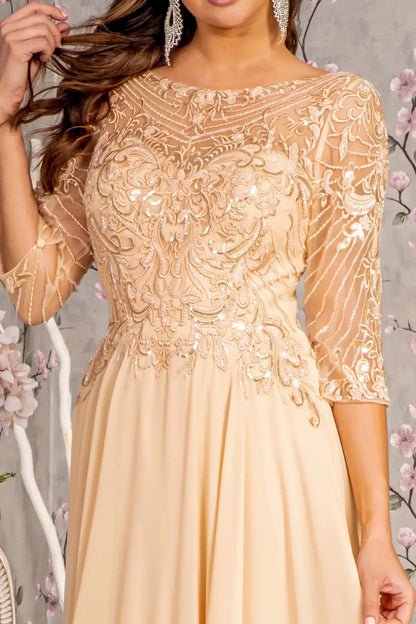 Bodice close-up highlights champagne mother of the bride dress featuring boat-neck bodice with 3/4 sleeve and beads, embroidery.