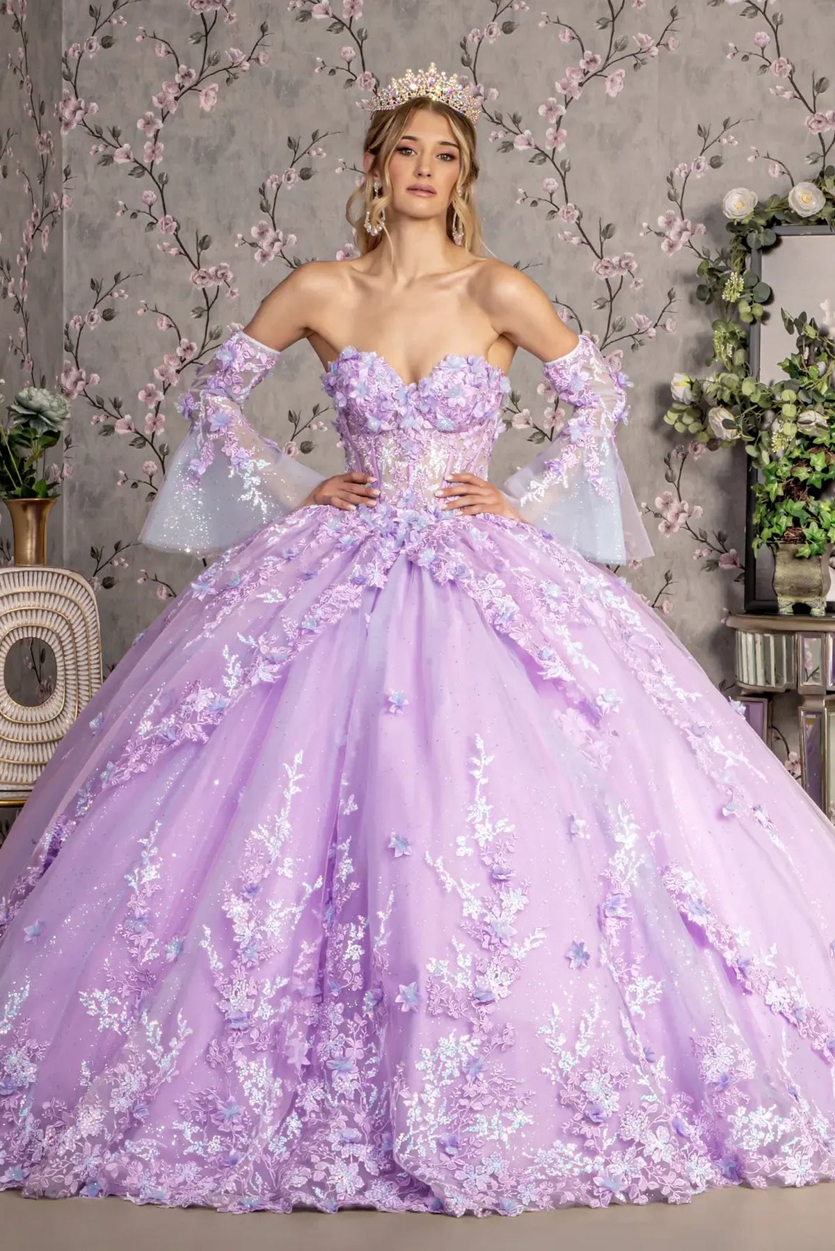 Embroidered details frame the Lilac quinceañera ball gown with long trumpet sleeves.