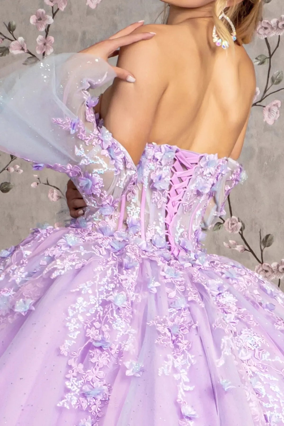Detachable accents complete the Lilac quinceañera ball gown with long trumpet sleeves.