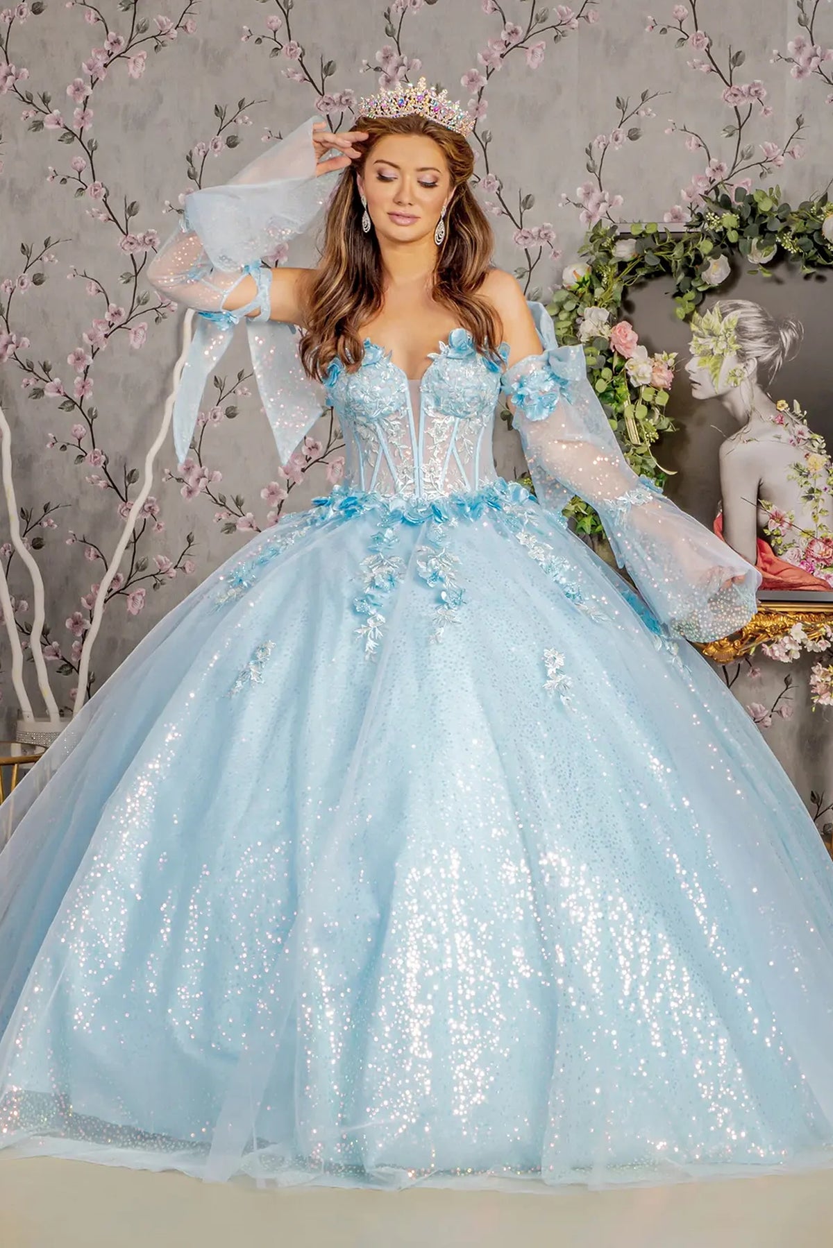Bodice close-up highlights the Baby Blue quinceañera ball gown with long sleeves.