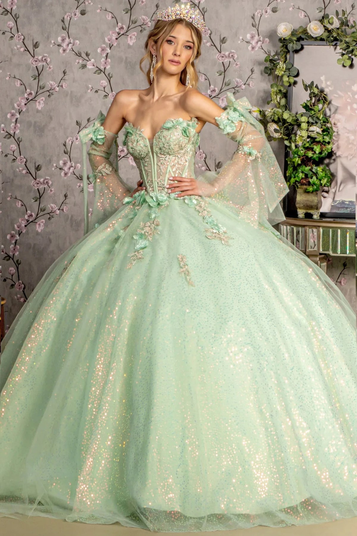 Lace-up back reveals the Sage quinceañera ball gown with lace-up back and long sleeves.