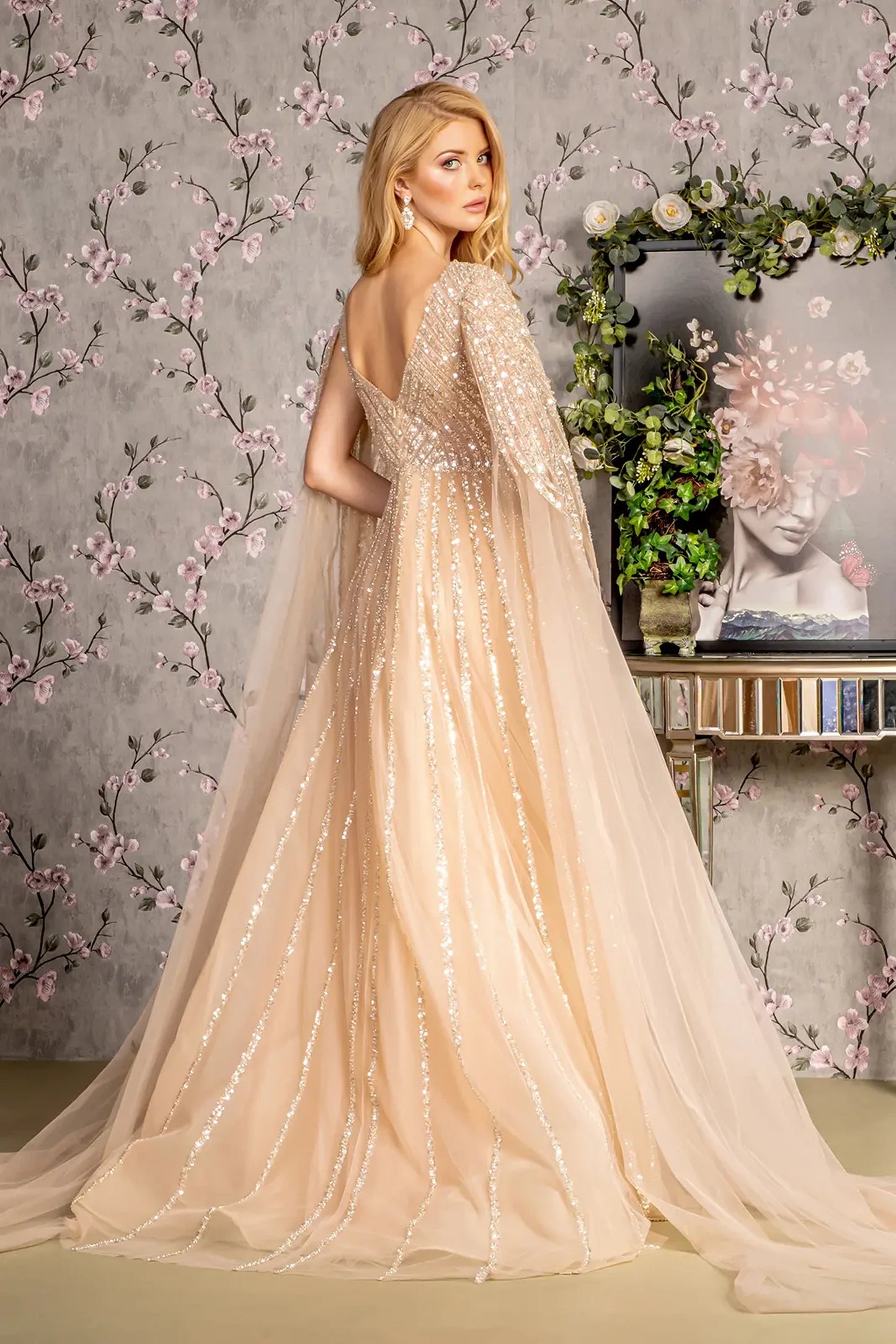 Champagne a-line mother of the bride dress with v-back with concealed zipper and cape sleeve
