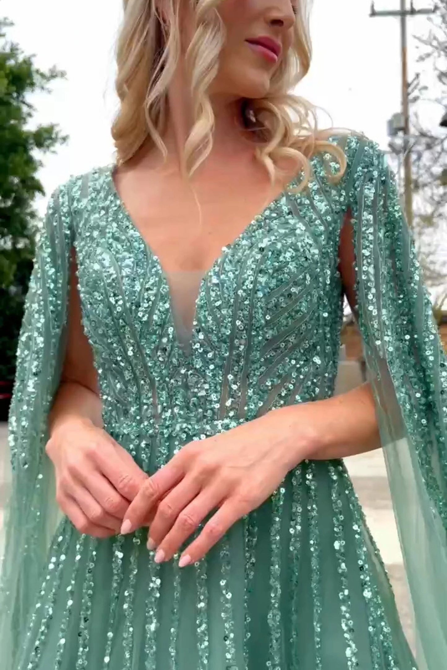 Sage mother of the bride dress featuring embellished bodice flowing into a mesh a-line skirt