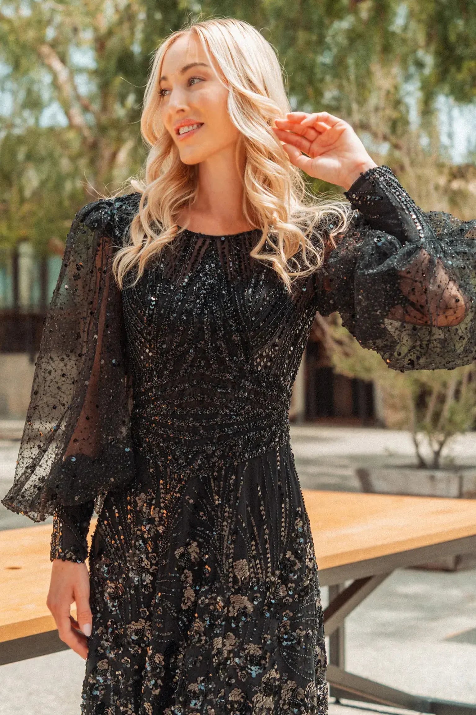 Black mother of the bride dress featuring scoop-neck bodice with long sleeve and beads, glitter, sequin