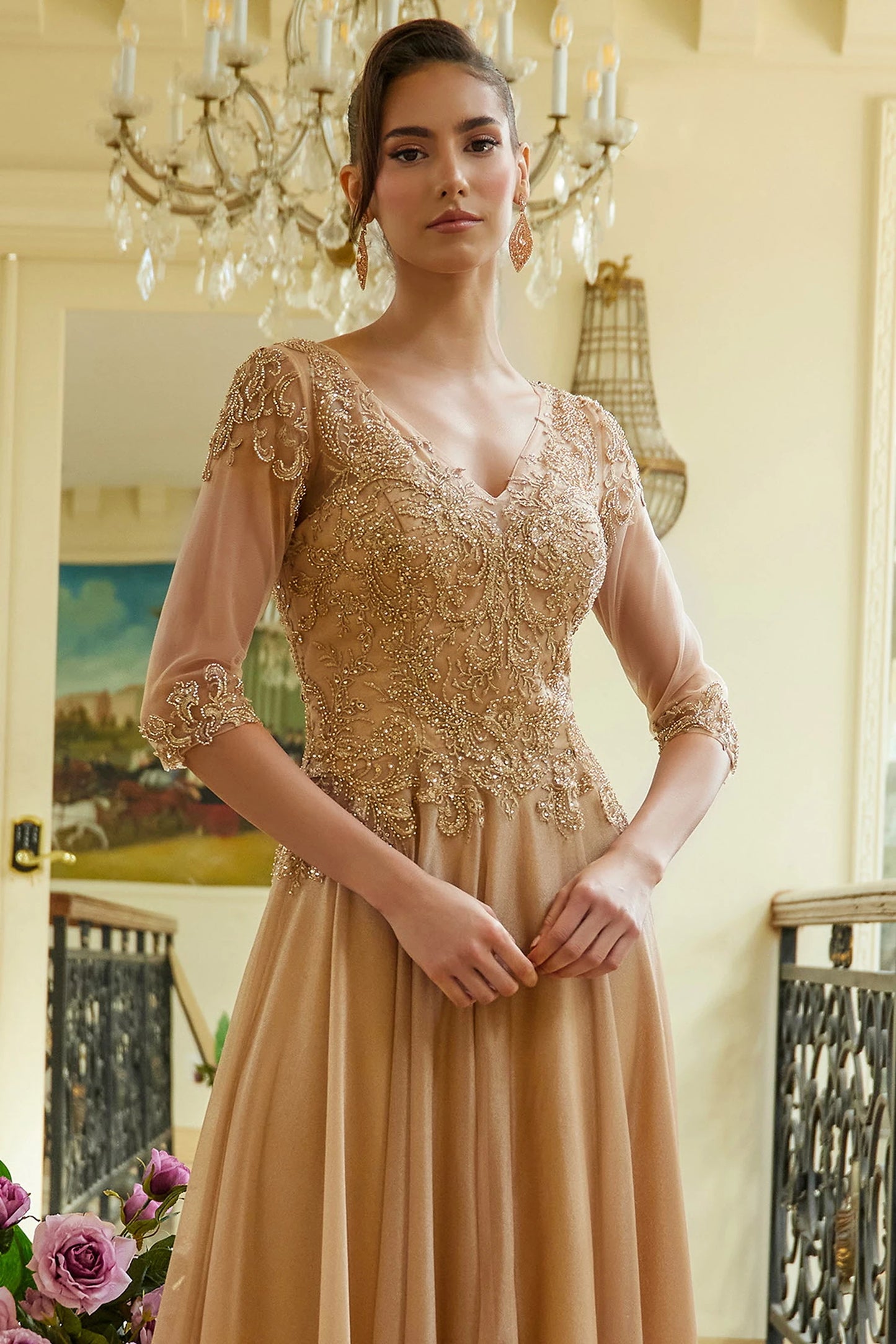 Gold mother of the bride dress featuring illusion v-neck bodice with 3/4 sleeve and beads, embroidery, jewel