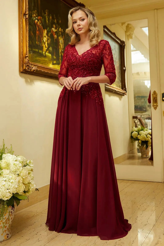 Detailed view highlights burgundy chiffon, mesh a-line mother of the bride dress with illusion v-neck.