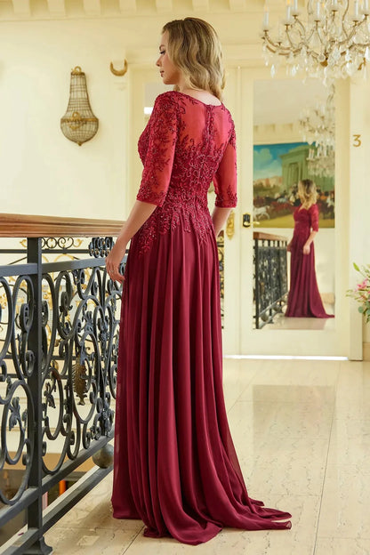 Rear view reveals burgundy a-line mother of the bride dress with concealed zipper back and 1/2 sleeve.