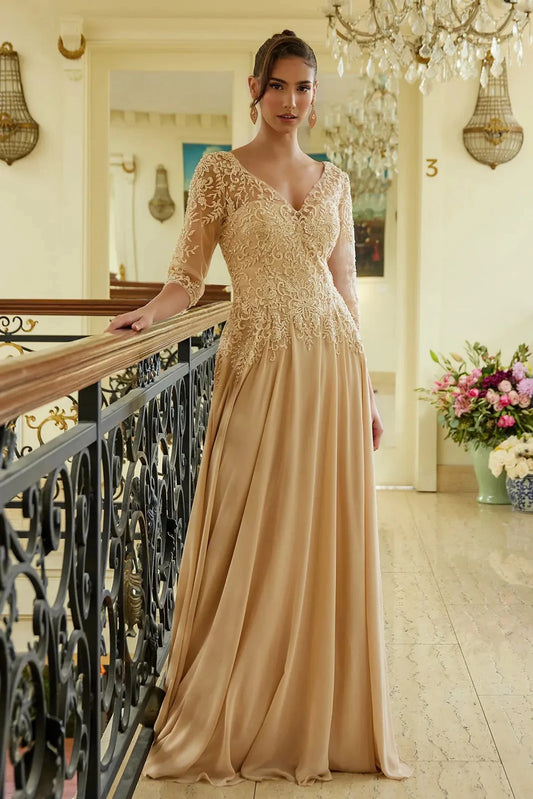 Detailed view highlights champagne chiffon, mesh a-line mother of the bride dress with illusion v-neck.