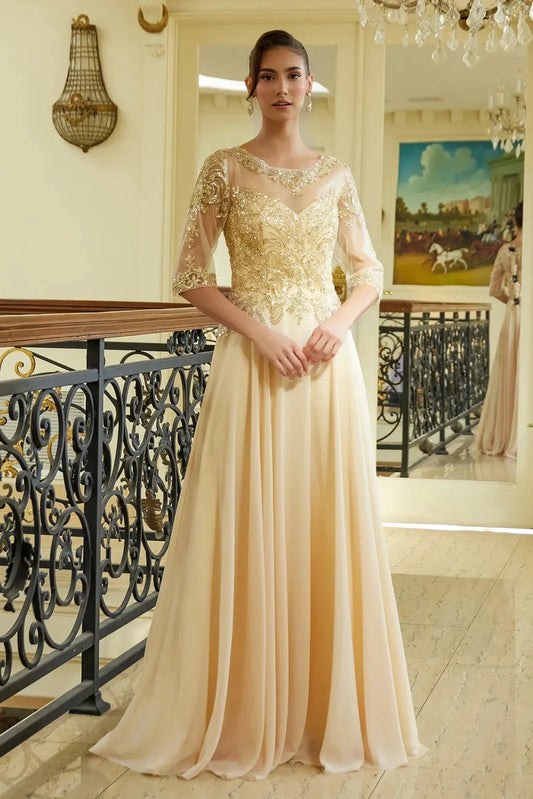 Detailed view highlights champagne chiffon, mesh a-line mother of the bride dress with illusion sweetheart.