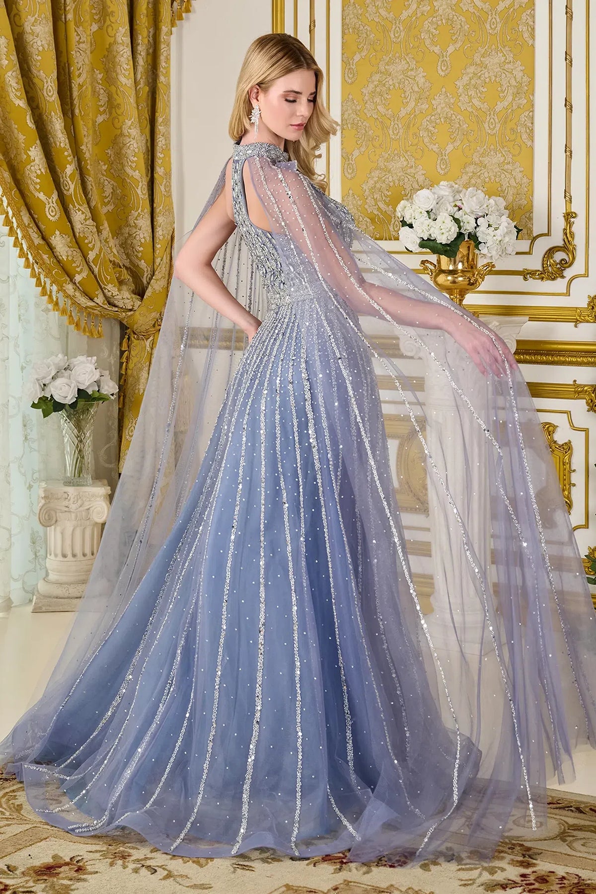 Dusty Blue mother of the bride dress with a long cape train over the A-line skirt