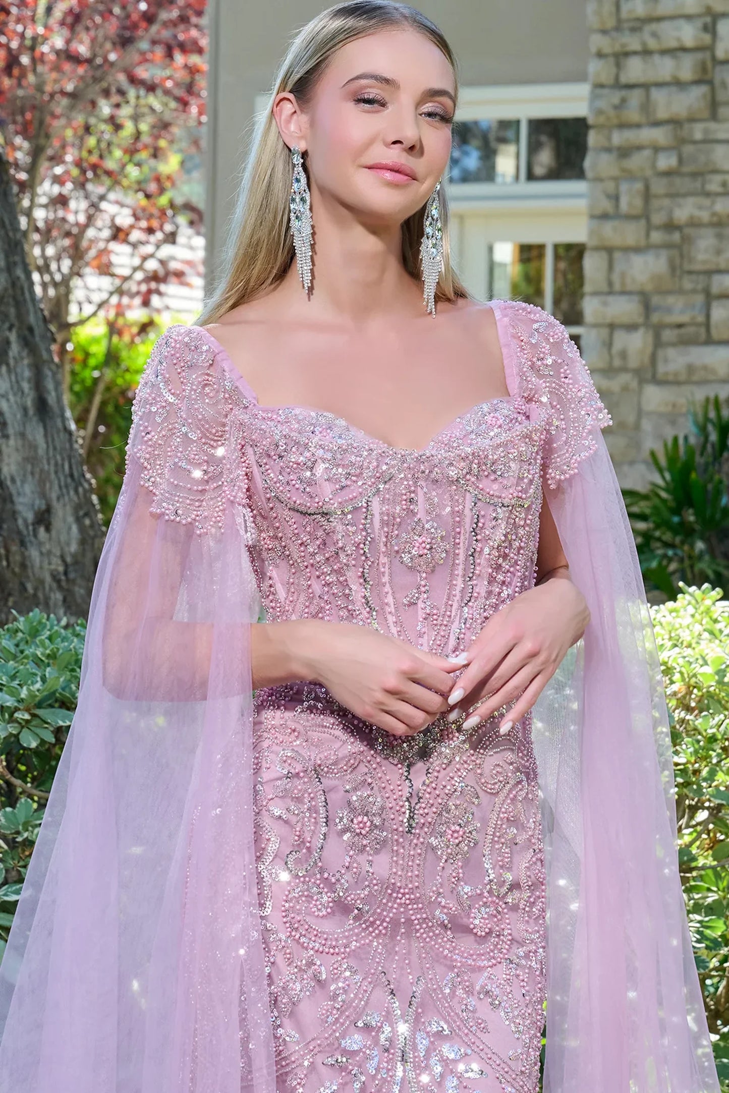 Dusty Rose mother of the bride dress featuring v-neck bodice with cape sleeve and beads, sequin