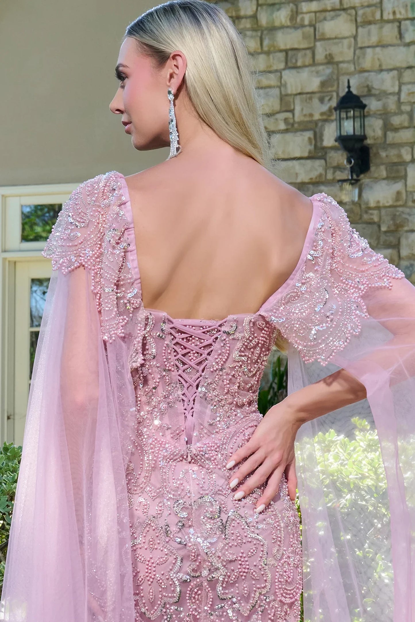 Dusty Rose mother of the bride dress featuring corset back bodice finished with beads, sequin