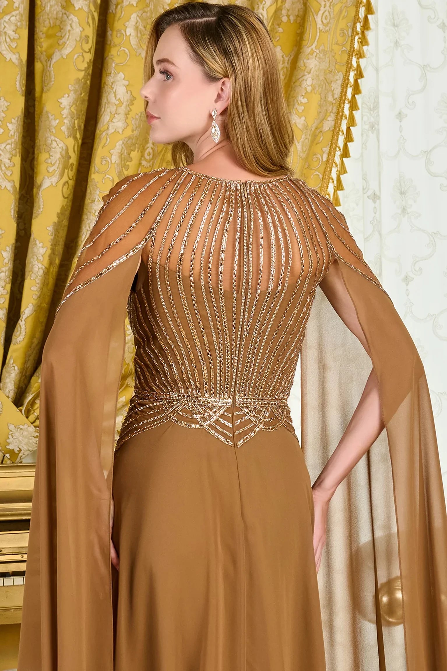 Light Brown mother of the bride dress featuring concealed zipper back bodice finished with jewel