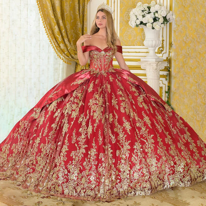 girl wearing burgundy ball gown with gold embroidery in an elegant room front view