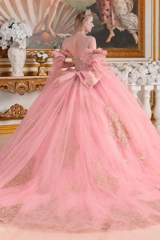 dusty rose ball gown with gold accents in an elegant room setting