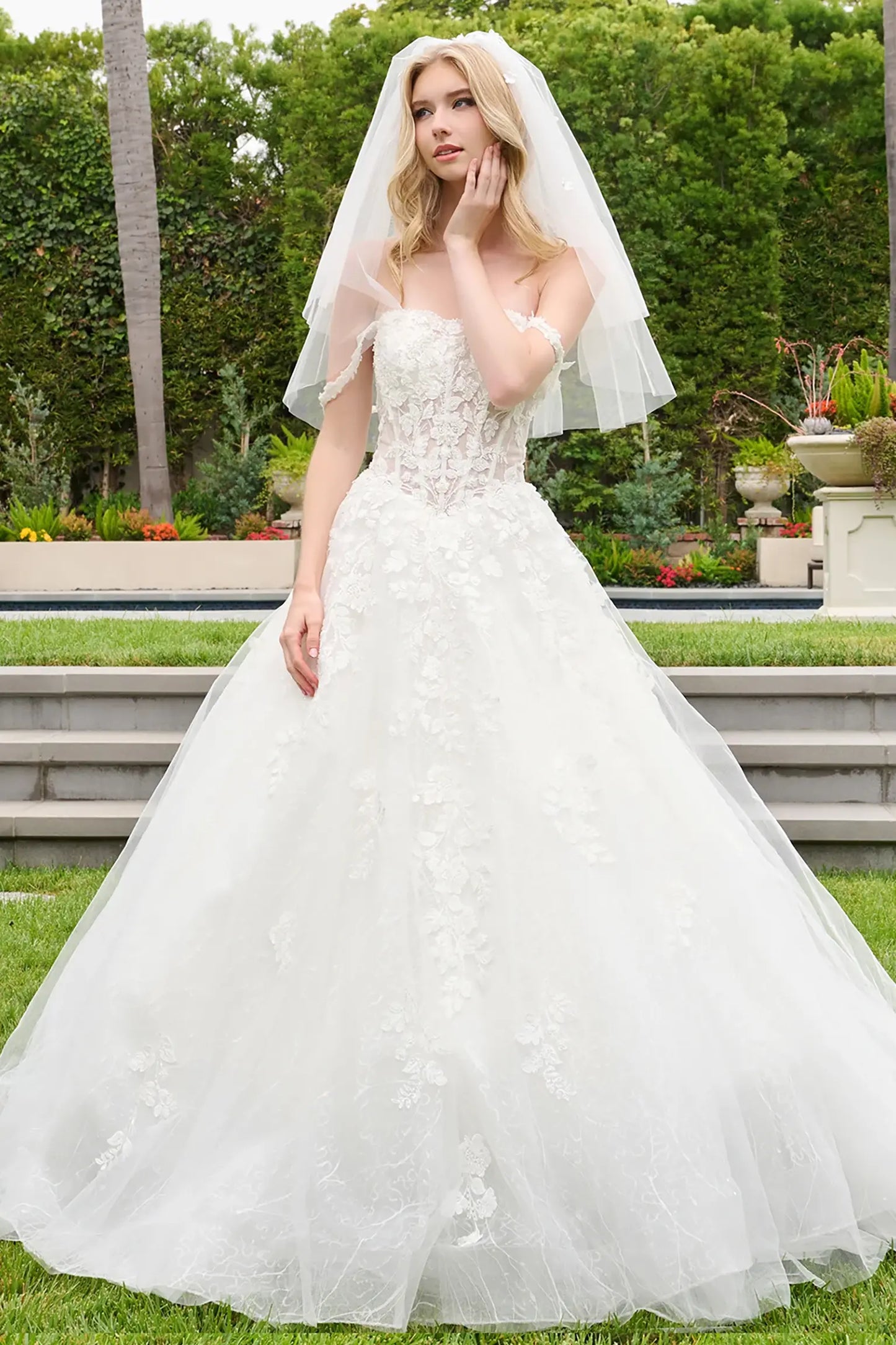 Off-white quinceañera ball gown with sweetheart neckline and flowing straps