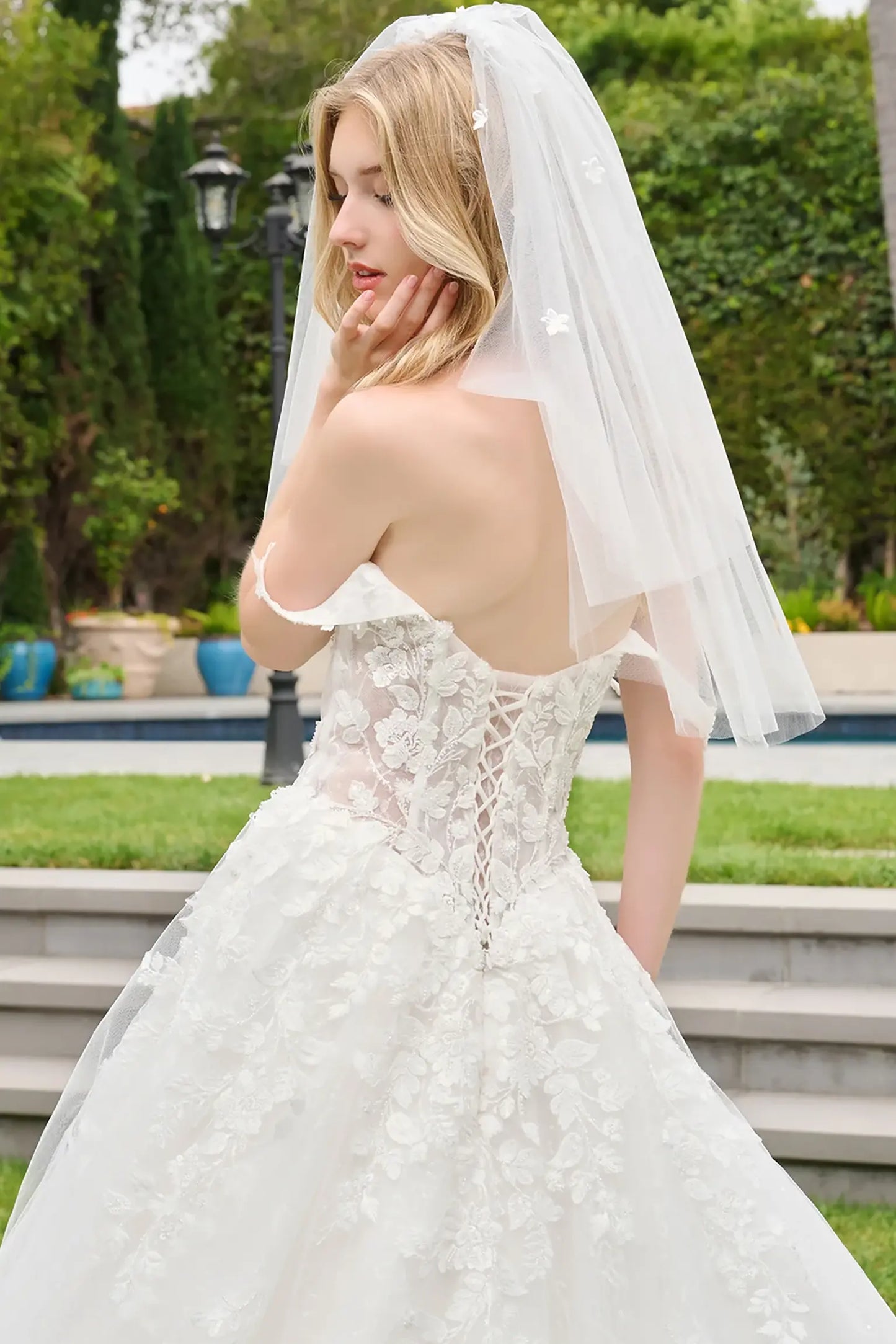Off-white quinceañera ball gown with lace back up corset bodice