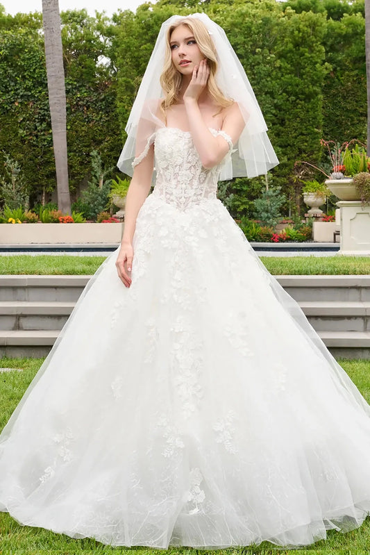 Off-white quinceañera ball gown with sweetheart neckline and flowing straps
