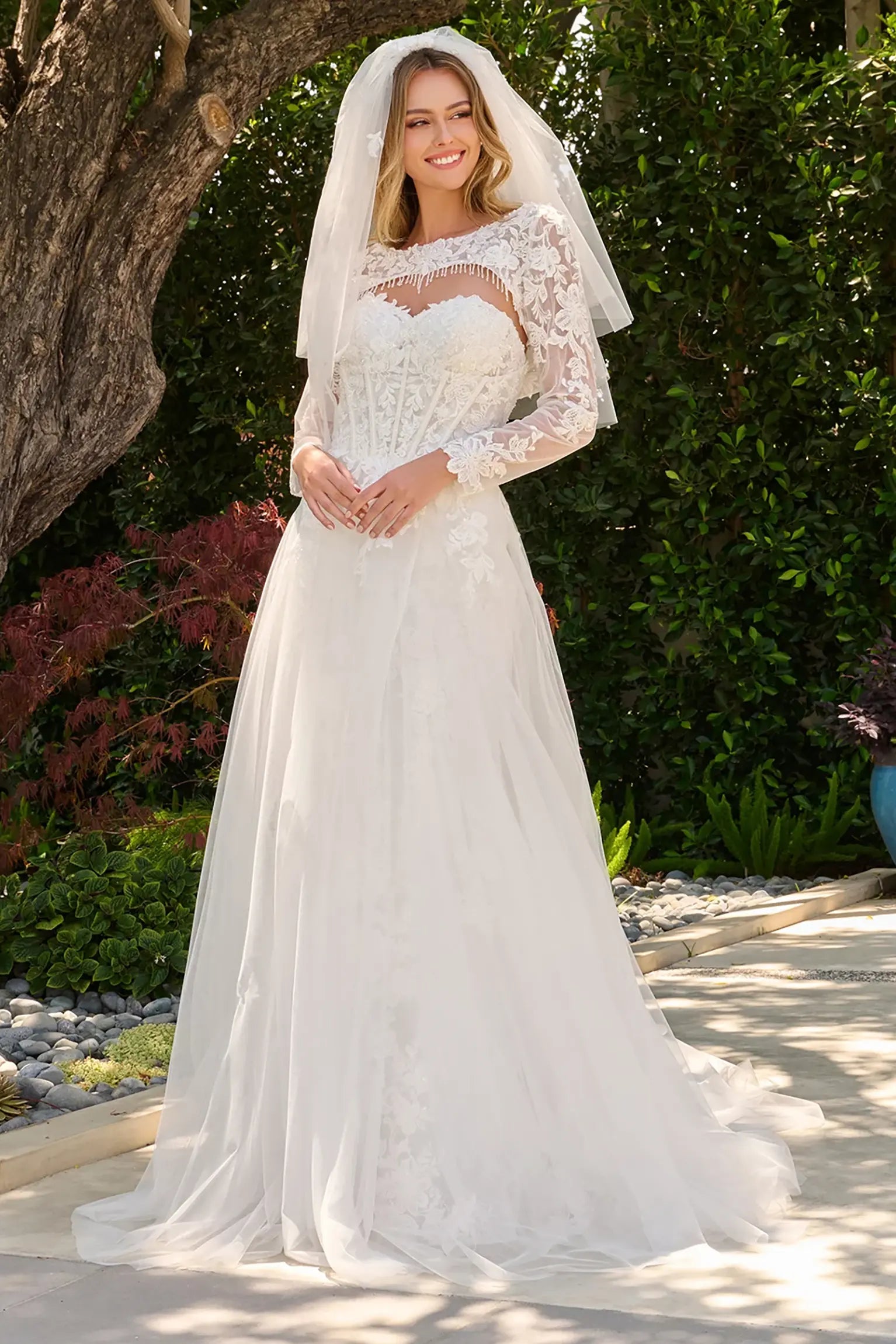 Off-white wedding dress featuring sweetheart corset bodice with beads, sequins and embroidery