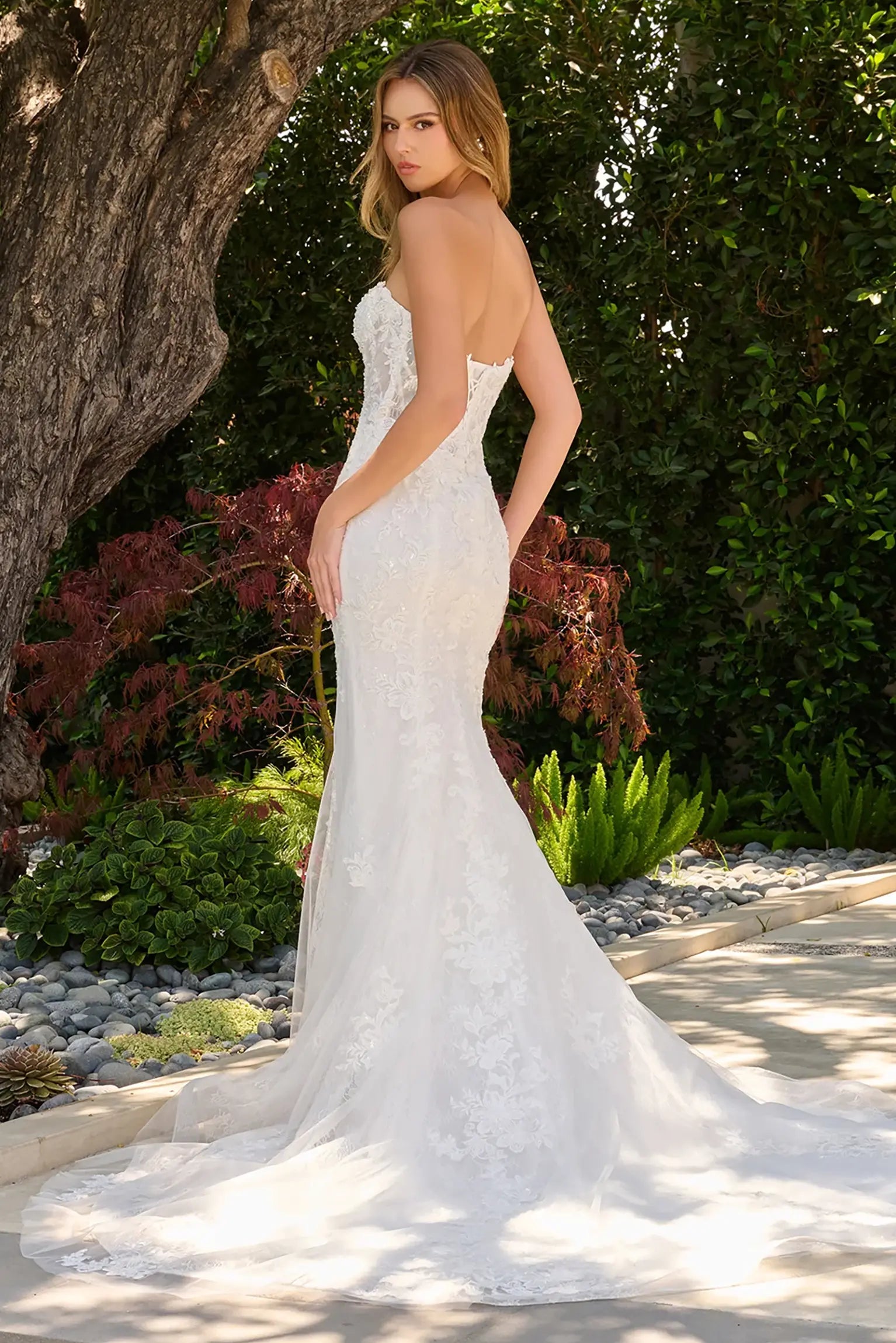 Off-white wedding dress featuring lace back up corset bodice with beads, sequins and embroidery