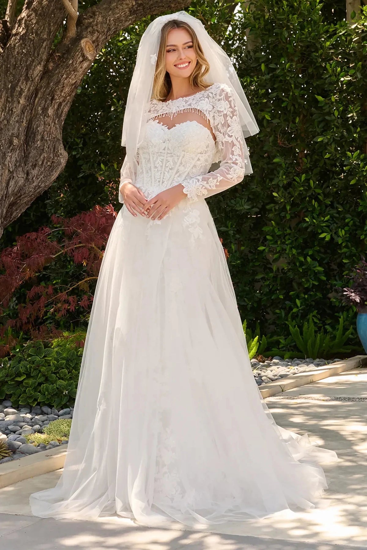 Off-white wedding dress featuring sweetheart corset bodice with beads, sequins and embroidery